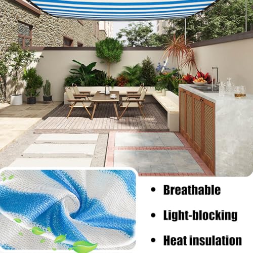 Toldo con ojales y tela azul y blanca que soluciona la falta de sombra en el jardín 3