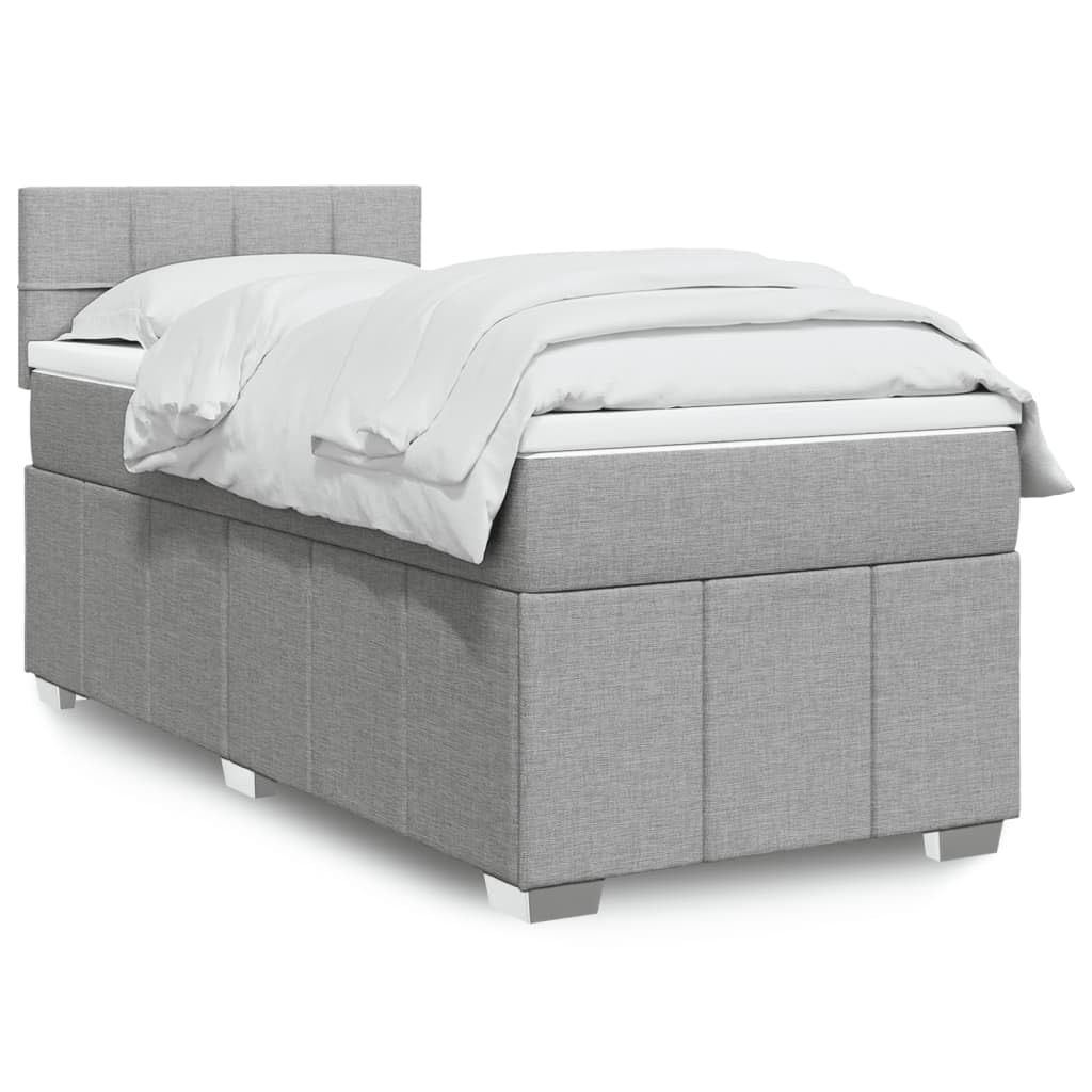 Łóżko kontynentalne 90 x 200 cm, jasnoszare z materacem ze sprężynami kieszeniowymi, miękkim obiciem z materiału, komfortowym topperem i oświetleniem LED do sypialni