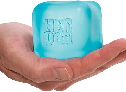 Aqua colored squishy cube in held in a palm