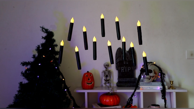 Image of Lezonic 12Pcs Floating Candles with Wand and Remote, Magic Black Flameless Candles Battery Operated, Flikering Hanging LED Taper Candlesticks Halloween Decorations, 0.8 inch x 6 inch