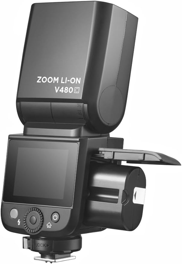 lateral view of the Flashpoint V480C flash with the battery compartment open, showing the battery being inserted.