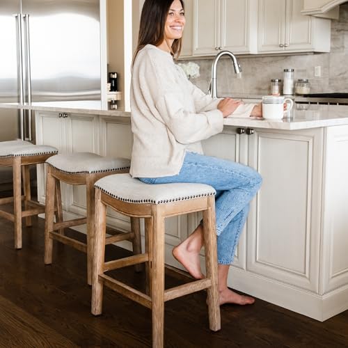 Image of Maven Lane Adrien Backless Counter Stool - Set of 2 - 26 Inches - Saddle Stool with Footrest - Natural Solid Wood Frame & Light Grey Fabric Upholstery - Perfect for Kitchen Islands & Counters