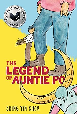 The Legend of Auntie Po by Shing Yin Khor, a graphic novel book cover featuring the lower half of a giant, wearing a pink shirt and blue jeans with brown boots. A lumberjill in a white shirt and brown pants with black shoes stand knee-high to this giant. She is carrying sticks and looking over her shoulder at the giant. A herd animal with crescent-moon shaped horns is peeking up at the reader from the lower right corner.