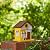 Glitzhome Birdhouses for Outdoors,Solid Wood Hanging Bird Houses for Outside, 9.5" H Modern General Store Decorative Pet Cottage Outdoor Garden Birdhouse for Outdoor Patio,Yellow