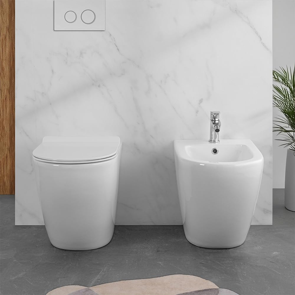 Wc e bidet rialzati filomuro per anziani e disabili, in ceramica scarico traslato 6-23 cm e sedile soft-close, serie COMODA