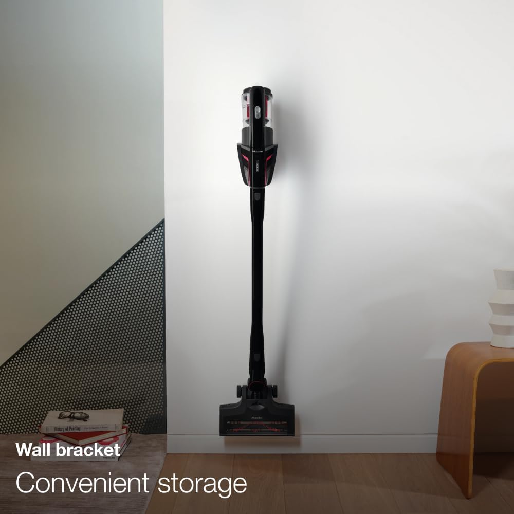 Miele Triflex HX1 mounted on a wall bracket for convenient storage.