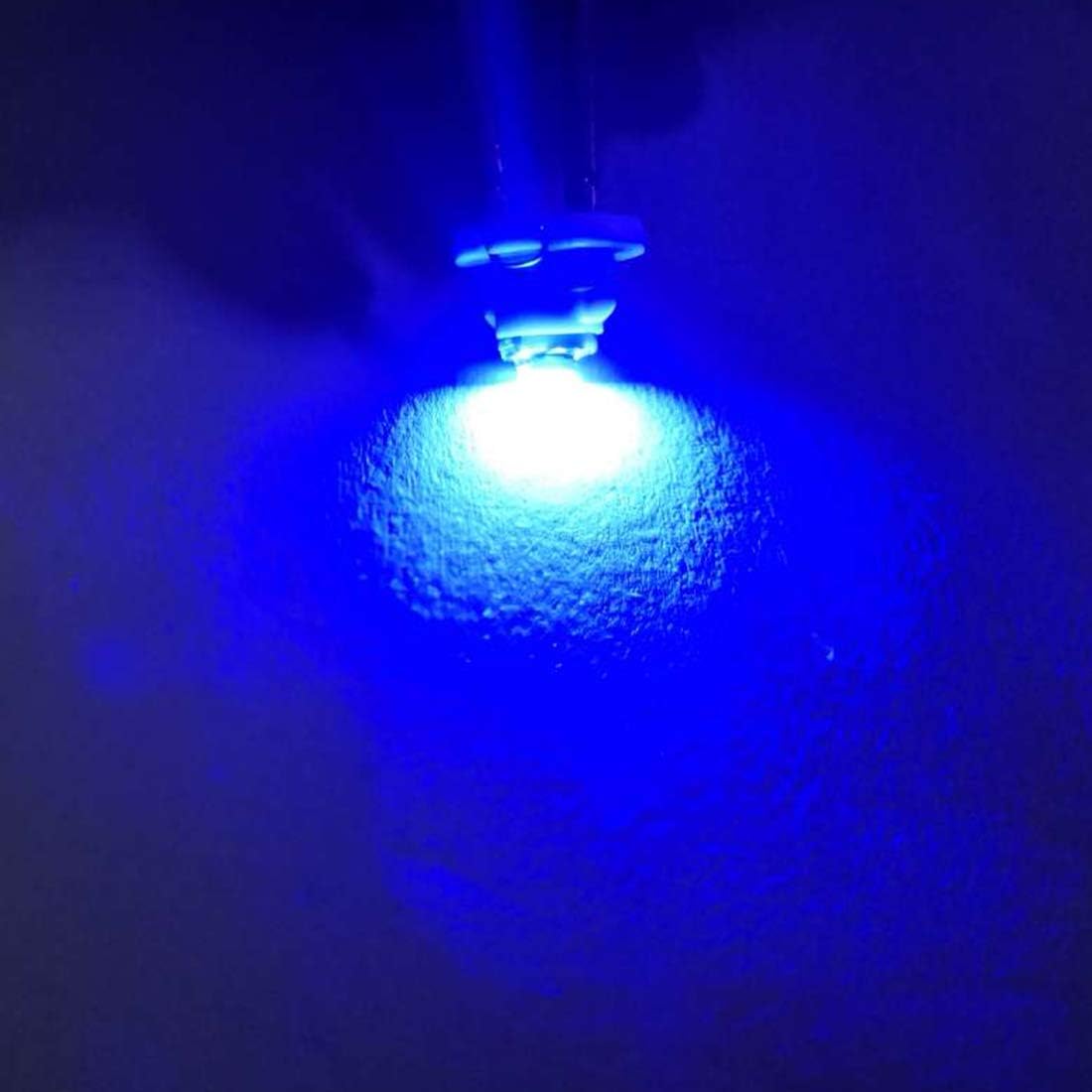 A single uxcell T4.2 LED bulb emitting a bright blue light against a dark background
