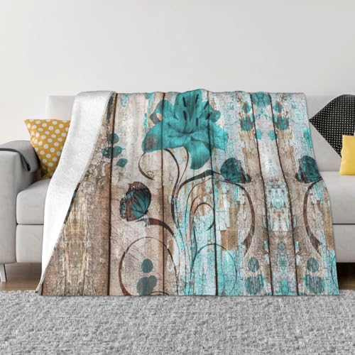Couverture flanelle fleur sarcelle pour soiree cocooning canape