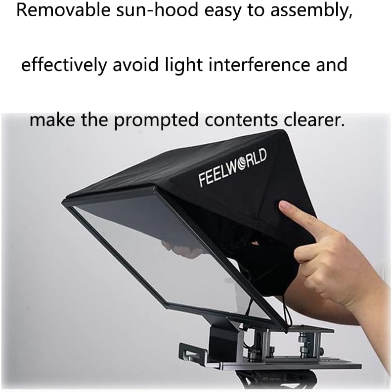 A hand adjusting the black fabric sun-hood over the teleprompter's glass, showing how it attaches to the frame.