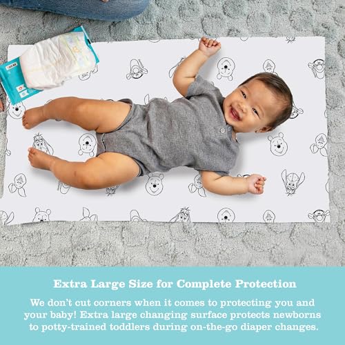 Image of Disney Baby by J.L. Childress Disposable Changing Pads for Baby - Diaper Changing Table Covers, Travel Essentials for Babies, Absorbent Liner Pads, Leak-Resistant, 26 inchx18 inch - Winnie the Pooh, 24 Count