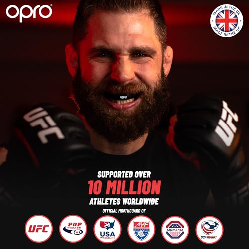 Atleta con barba sonriente usando el protector bucal OPRO, respaldado por más de 10 millones de atletas en todo el mundo