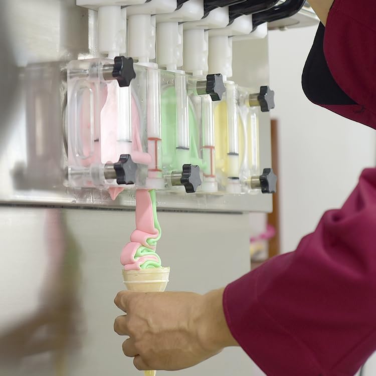 Hand dispensing soft ice cream from the machine