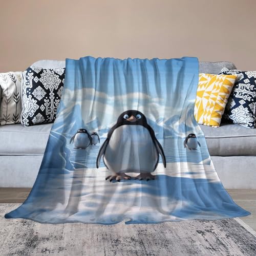 Couverture flanelle pingouin pour soirée cocooning sur le canapé