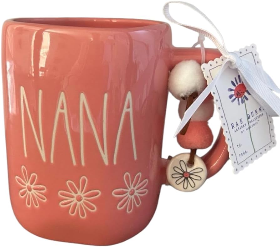 Rae Dunn Nana ceramic coffee mug. Pom pom and charm detail. Pink