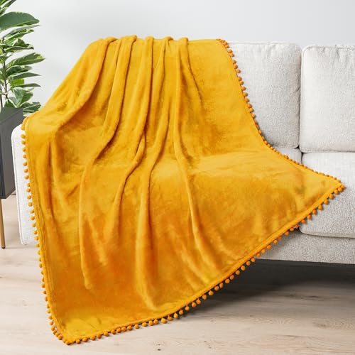 PAVILIA Fleece Throw Blanket for Couch with Pom Pom Fringe, Mustard Yellow, Soft Cozy Fuzzy Flannel Blanket for Sofa Bed, Lightweight Plush All Season Throw, 50x60 Inches