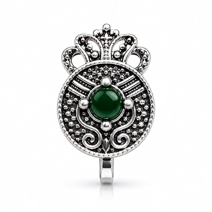 Make a graceful style statement with this fancy oxidised silver finish nose pin from Anuradha Plus Jewellery. Featuring a round royal crown design with a vibrant green stone centerpiece, this adjustable press-on nose ring offers a secure fit without piercing. Lightweight and comfortable, it is perfect for weddings, festive celebrations, Navratri, traditional outfits, parties, and everyday ethnic fashion for women and girls.-image-44