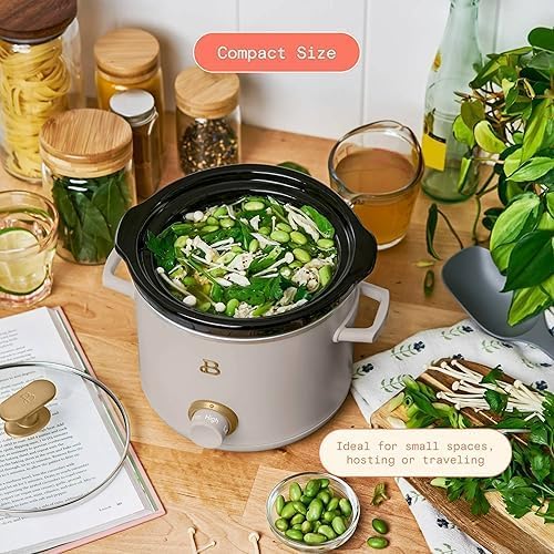 A Beautiful by Drew Barrymore slow cooker on a kitchen counter, with text highlighting its compact size and suitability for small spaces, hosting, or travel.