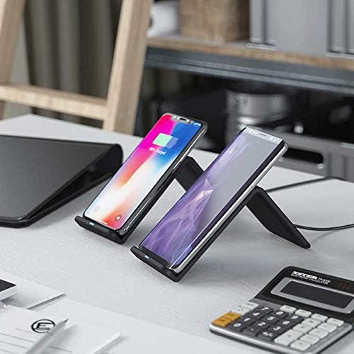 Two smartphones charging on Atomi Wireless Charging Stands on a desk