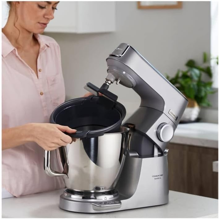 Person attaching the Kenwood Vegetable Sieve to a stand mixer