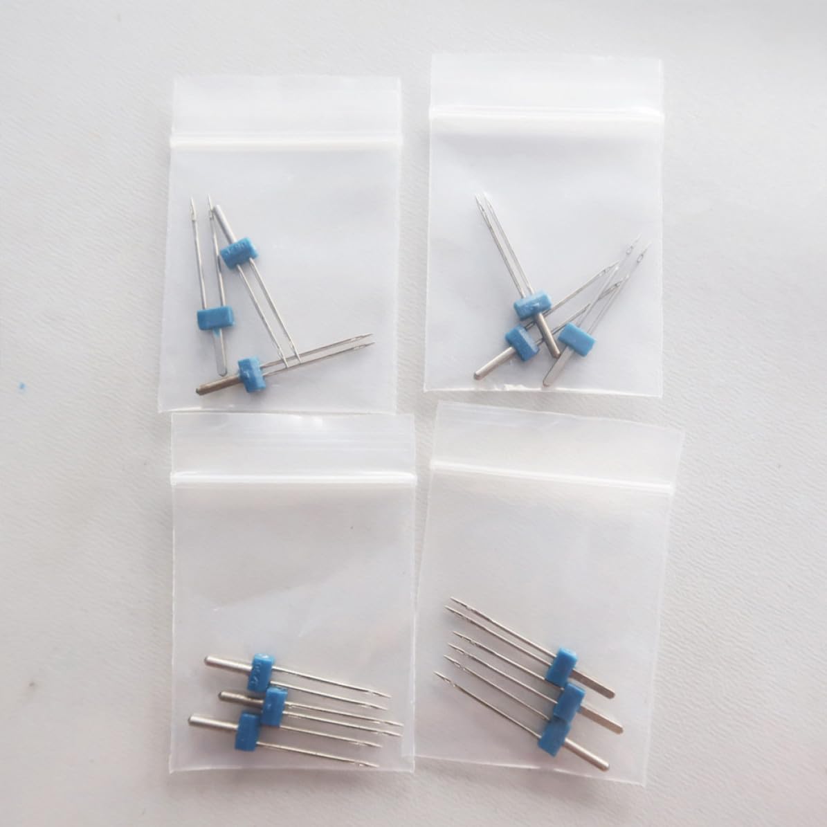 DOITOOL 100 Stück Elektrisches Multifunktions Zwillingsnadeln Satz für Nähmaschinen aus Metall Kompatibel mit Meisten Haushaltsnähmaschinen Einfach zu Lagern für Strickwaren und Jersey