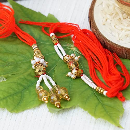 UtsaWe Rakhi Gift Box Made Of Gold Beads Bhaiya Bhabhi Rakhi Set With Pearl Embellishments, that include Roli, Chawal, Raksha Bandhan Card, Thali Set, and a Chocolate (Adorable Couple Rakhi Gift Box)2
