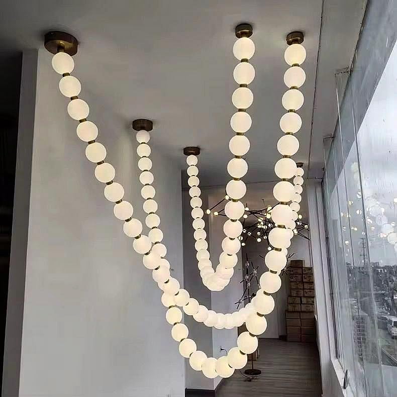 Modern Creamy Pearl Phandelier Luxurious Long-Shaped Chandelier Luminous Spherical Pendant Light Suitable for High Ceilings Living Rooms Staircase