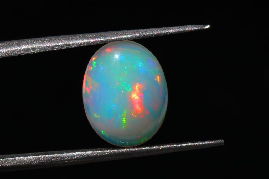 Ópalo etíope de fuego natural Cabujón Piedra preciosa natural Forma ovalada Tamaño 13,2x10,4x4,1 mm Peso 2,4 cts