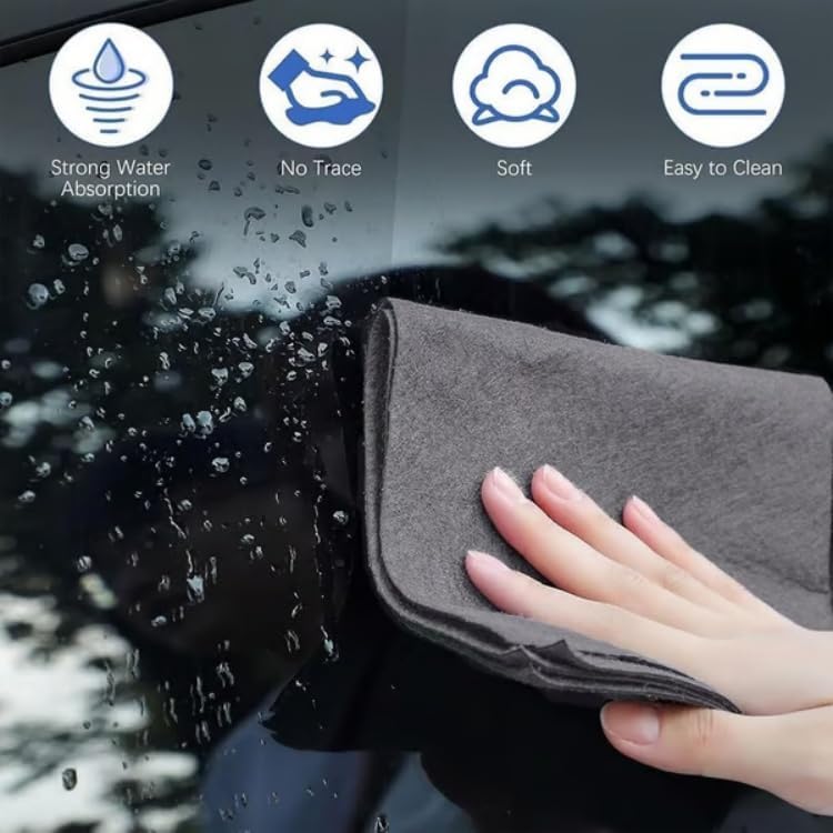 A hand using a gray cleaning cloth to wipe a car window, with icons indicating strong water absorption, no trace, softness, and easy to clean features.