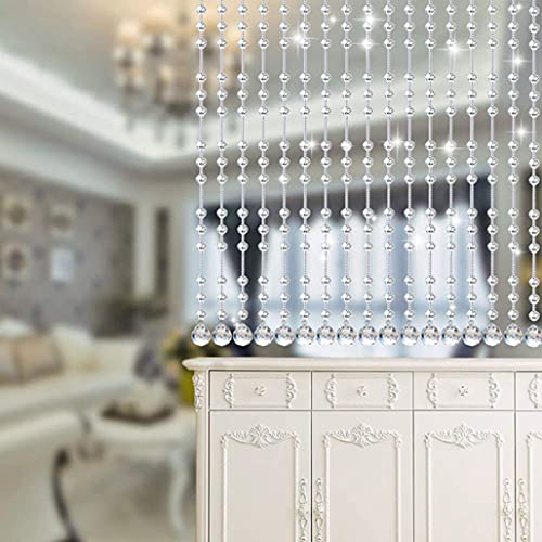 Rideaux de séparation de pièce en cristal pour structurer un studio sans perdre de lumière