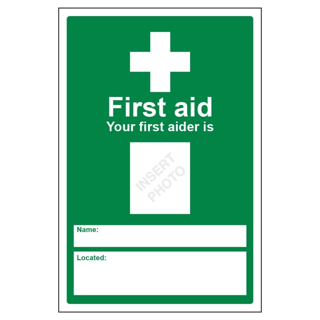 V Safety Your First Aider Is: 200 x 300mm - 2mm Rigid Plastic Safety Sign