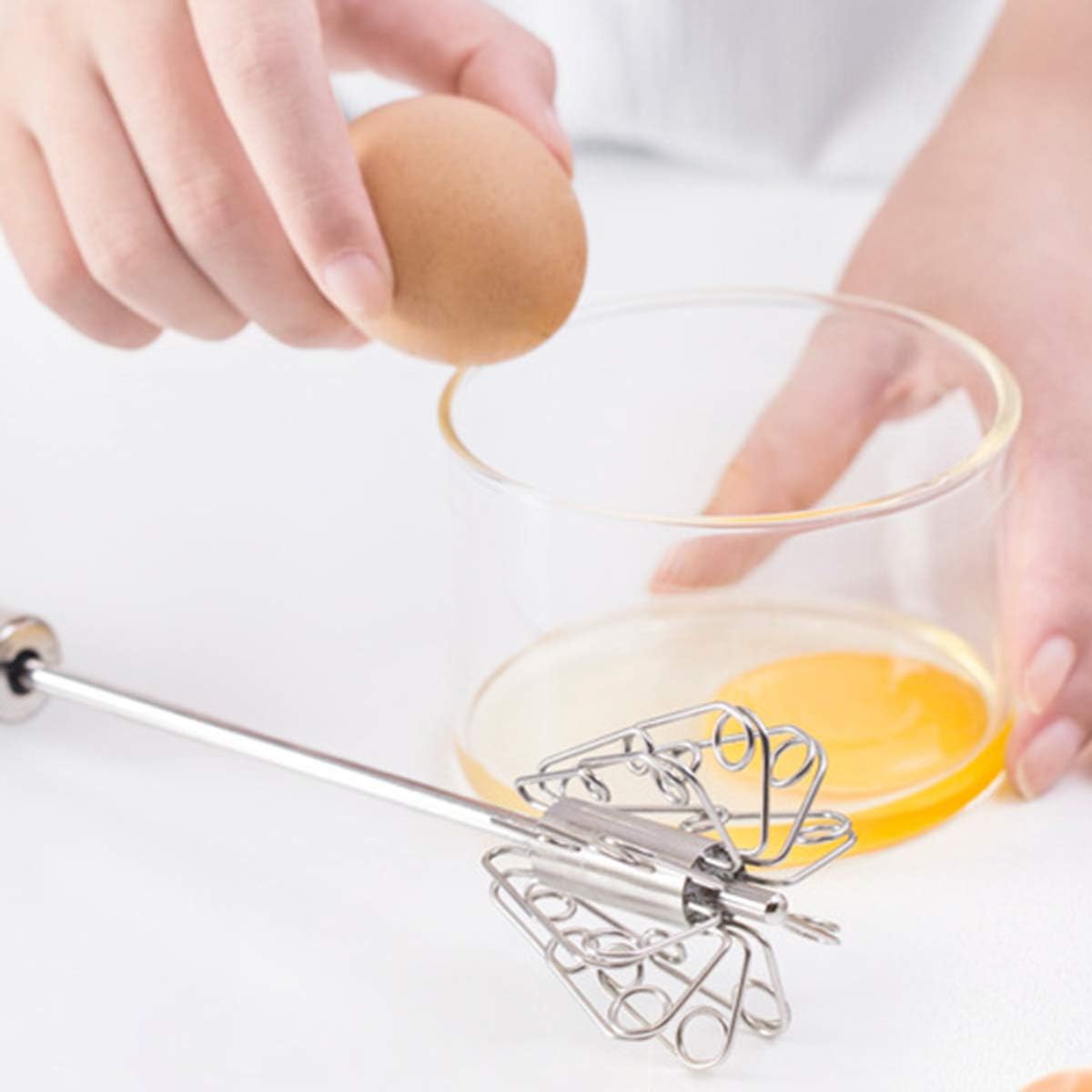 Whisking eggs in a glass bowl
