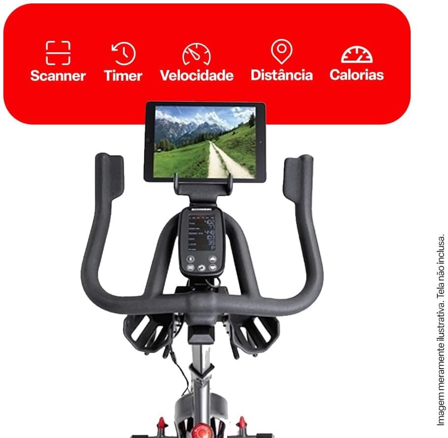 Vista frontal da Bike Spinning 800ic Schwinn com foco no painel LCD em destaque sobre fundo branco com faixa vermelha superior com informações.