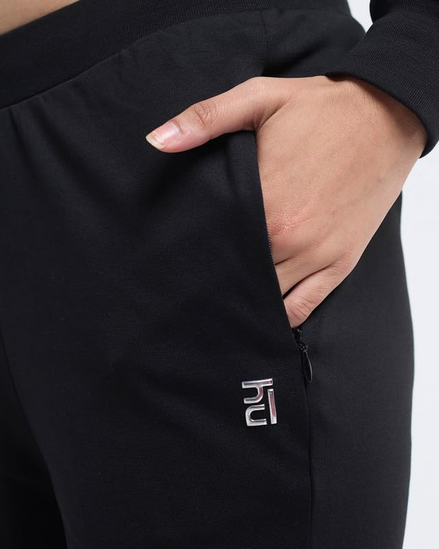 Image of HUNNIT Essential Flare Pants for Women with Zip Pockets | Mid Waist Solid Cotton Tapered Flare Pants | Bootcut Flared Trousers with Wide Elastic Waistband | Relaxed Fit Flared Trouser