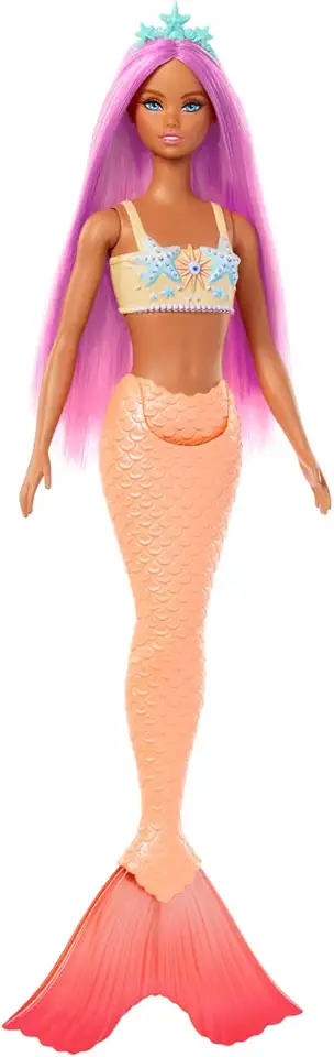 Boneca Barbie Sereia Cabelo Roxo Mattel. Look lilás com cauda brilhante e tiara de concha para brincar no fundo do mar. Para crianças a partir dos 3 anos.