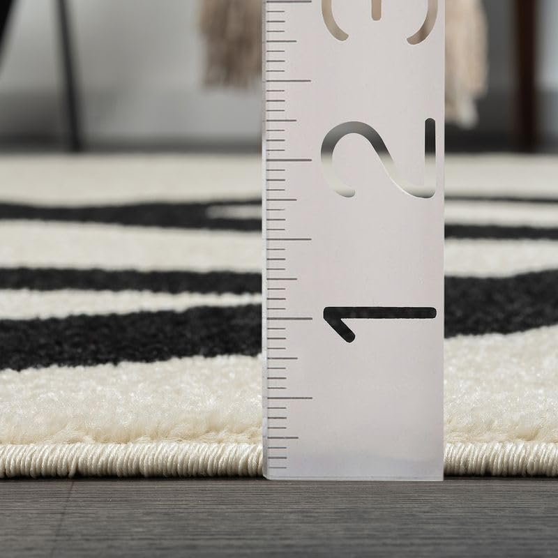 6' x 9' Black and Beige Abstract Rectangular Rug