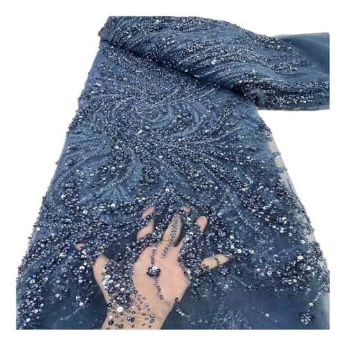Tissu en dentelle bleu orné de paillettes pour confectionner une robe de soirée sur mesure