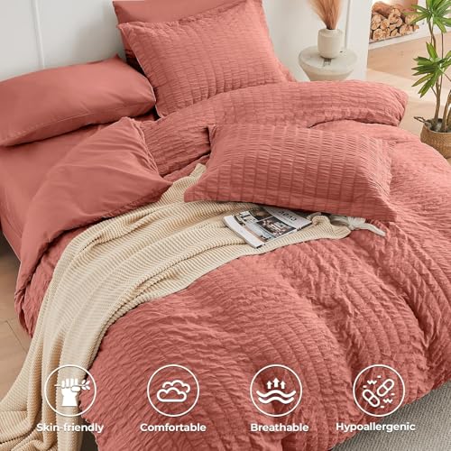Image of HYMOKEGE Coral King Size Comforter Set Seersucker 7 Pieces, All Season Luxury Bed in a Bag for Bedroom, Bedding Set with Comforter, Sheets, Pillowcases & Shams