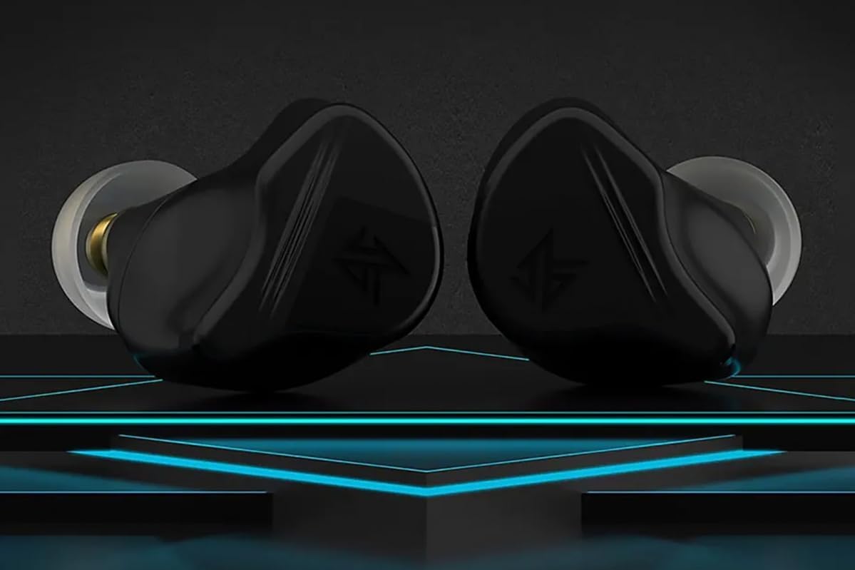 క్లోజ్-అప్ view of two KZ VXS Pro earbuds, showcasing their ergonomic design and ear tips.