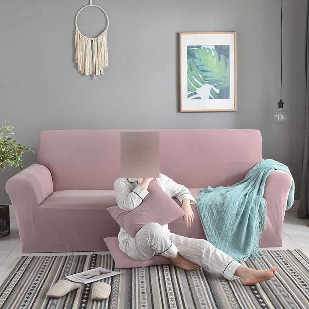 Housse de canapé extensible rose pour un salon chaleureux et moderne