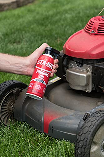 Spraying fogging oil into engine cylinder