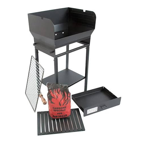 Barbecue in ferro rinnovato ed equipaggiato con griglia e spiedo