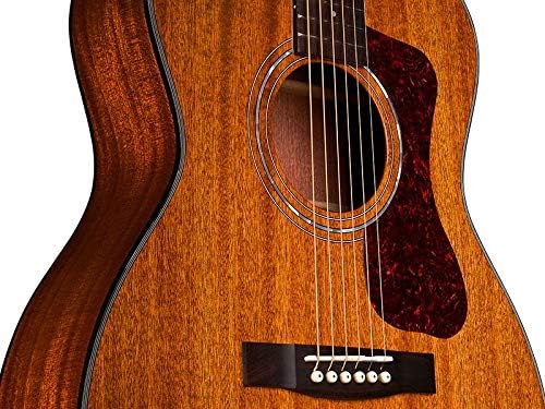 Close-up of the Guild OM-120 soundhole and bridge