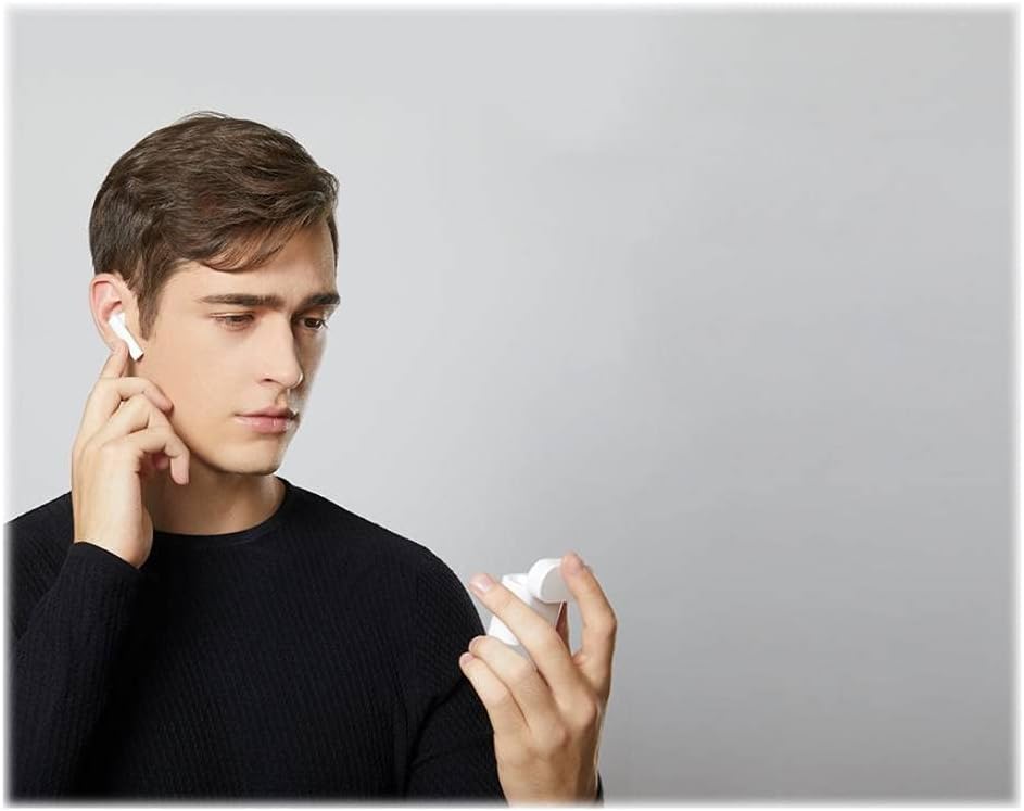 Person wearing a Xiaomi Mi True Wireless Earphone 2S