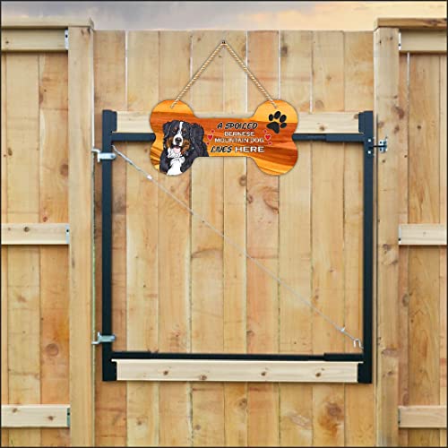 Image of CVANU Laser Cut MDF Wooden Funny Dog Sign Plaque Bone Design A Spoiled Bernese Mountain Dog Lives Here Animal Love Sign Board, Name Plate for Dog House Black & White, Size(10x5) inch
