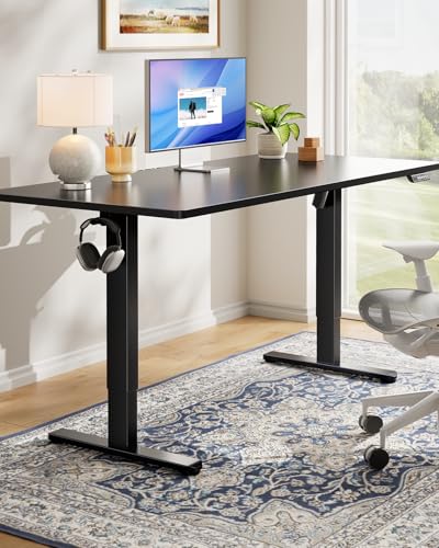 Image of HUANUO Electric Standing Desk, Whole Piece Desktop, Adjustable Height Computer Desk, 4 Height Memory Settings, Sit Stand Up Desk for Home Office, 55 inch x 27 inch, Black