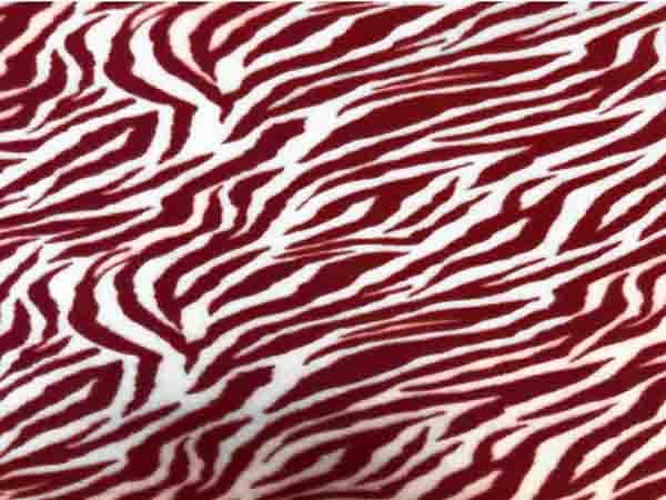 Tela polar con estampado animal rojo blanco cebra tela por The Yard disponible en Yaxa Peru