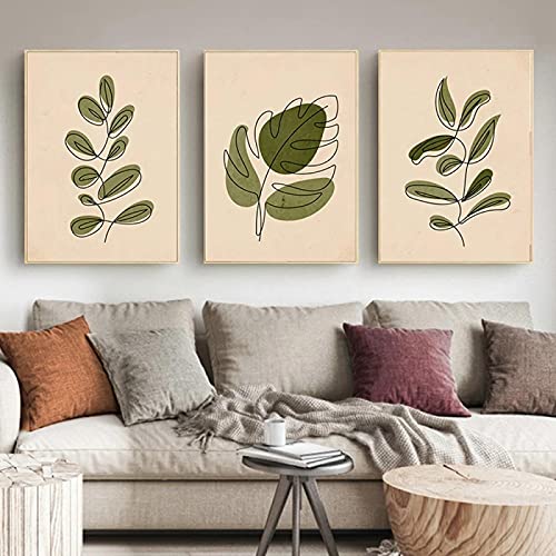 Affiche minimaliste femme et deco feuille verte pour habiller un grand mur de salon vide