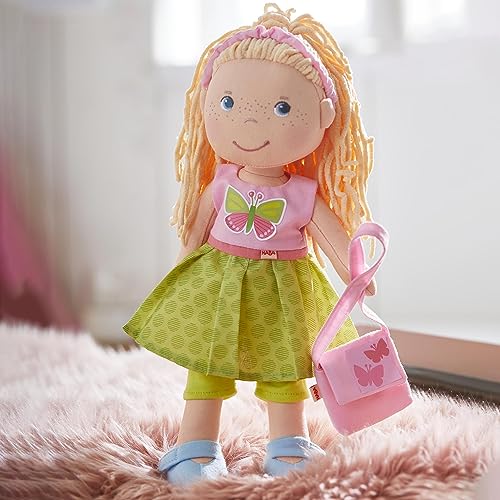 HABA 304253 - Kleiderset Schmetterling, Set aus Kleid, Hose, Handtasche und Haarband, Puppenzubehör für alle 30 cm großen Puppen, ab 18 Monaten