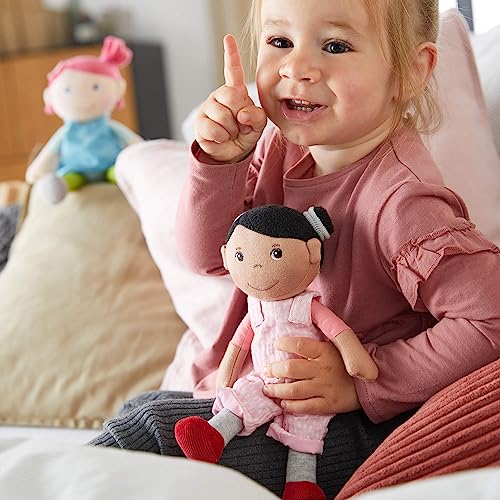 Image of HABA Snug Up Doll Rumbi - 10 inch Soft Doll with Black Hair and Pink Overalls - Machine Washable for 18 Months and Up