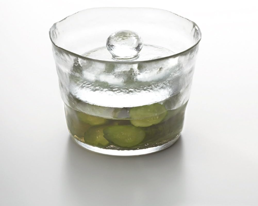 KINTO 55017 Pickle Container filled with green pickled cucumbers.